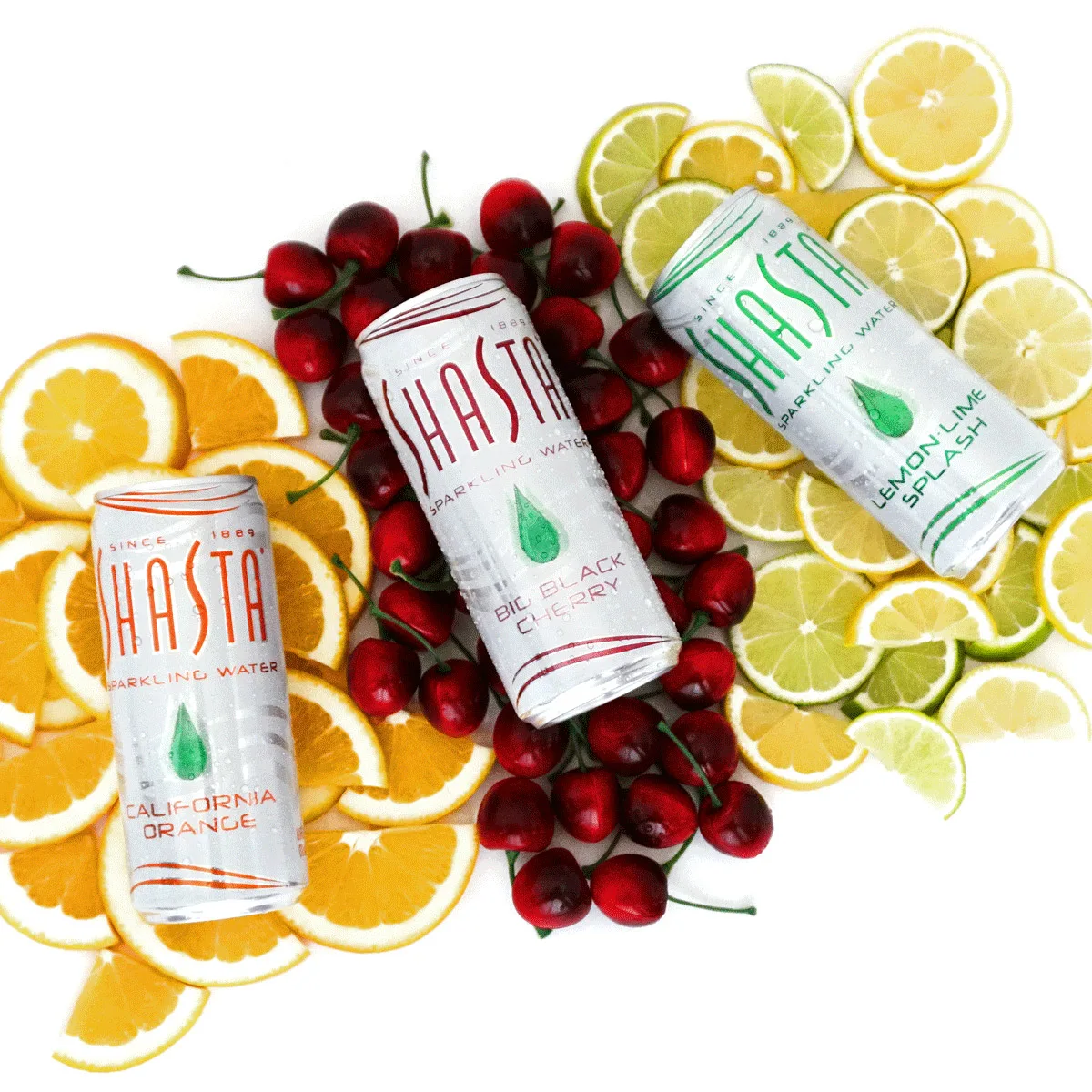 Shasta sparkling water cans laying on fruit